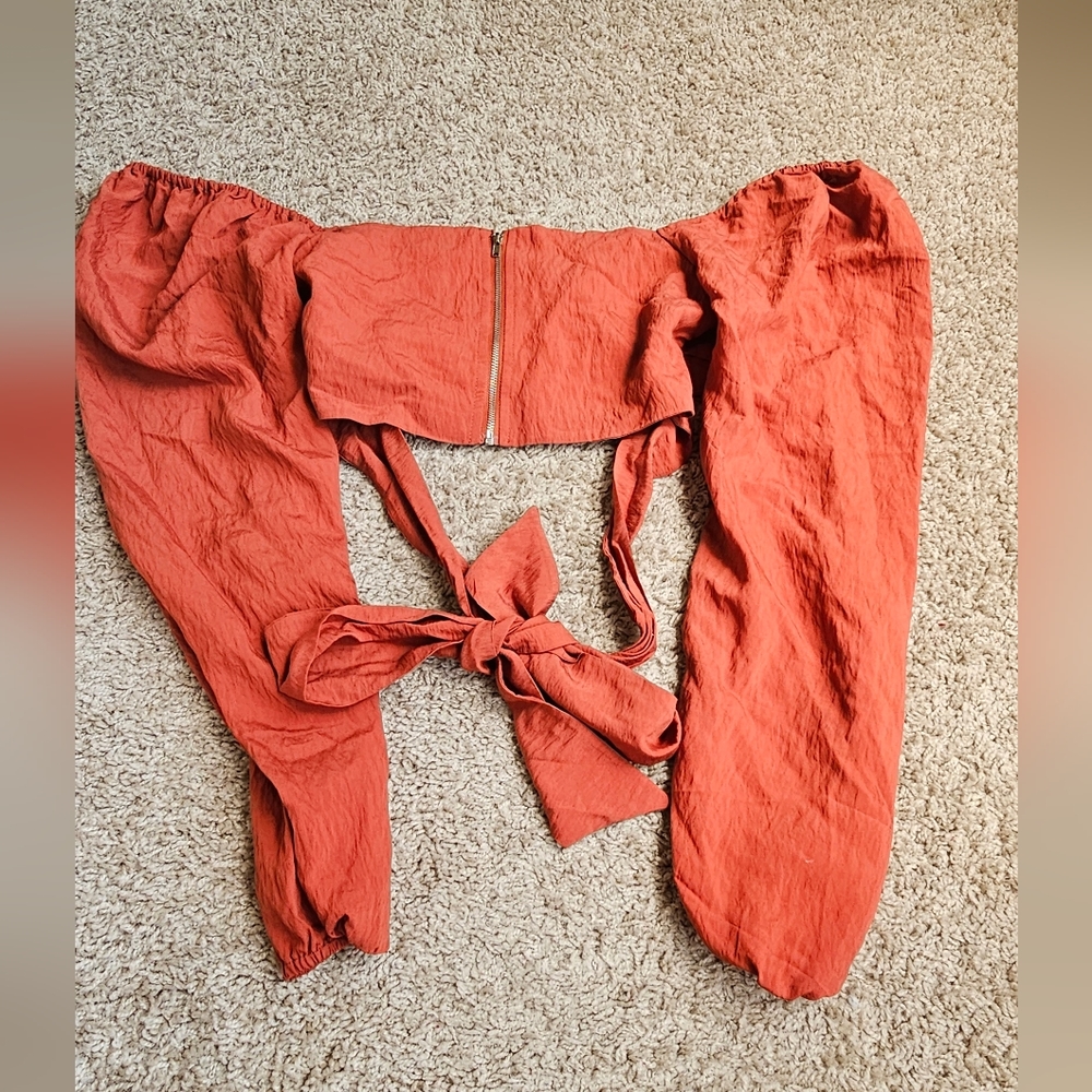 Girls(junior) orange off the shoulder top. Size(s).